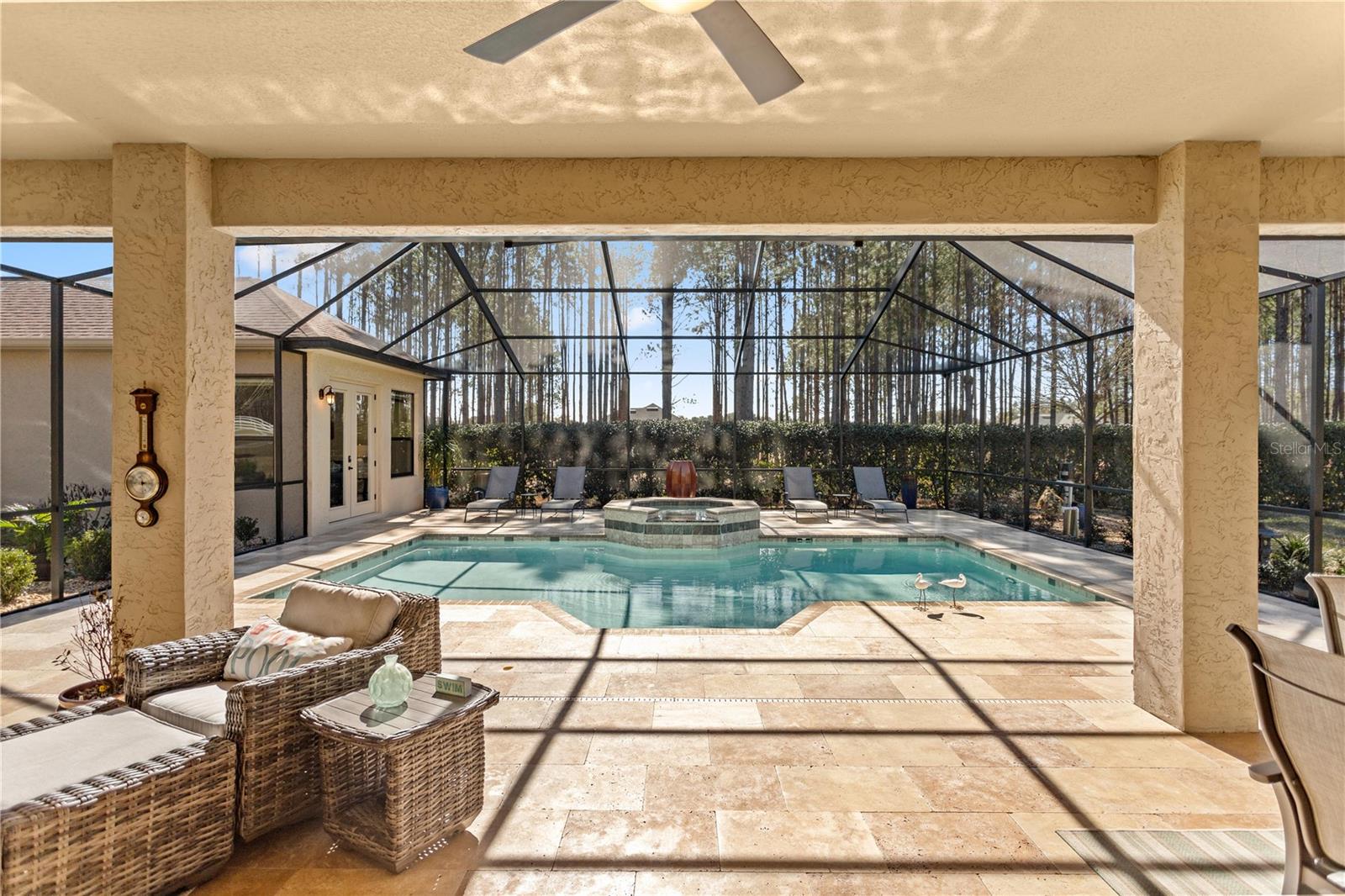 Covered Lanai leading to gas heated saltwater pool