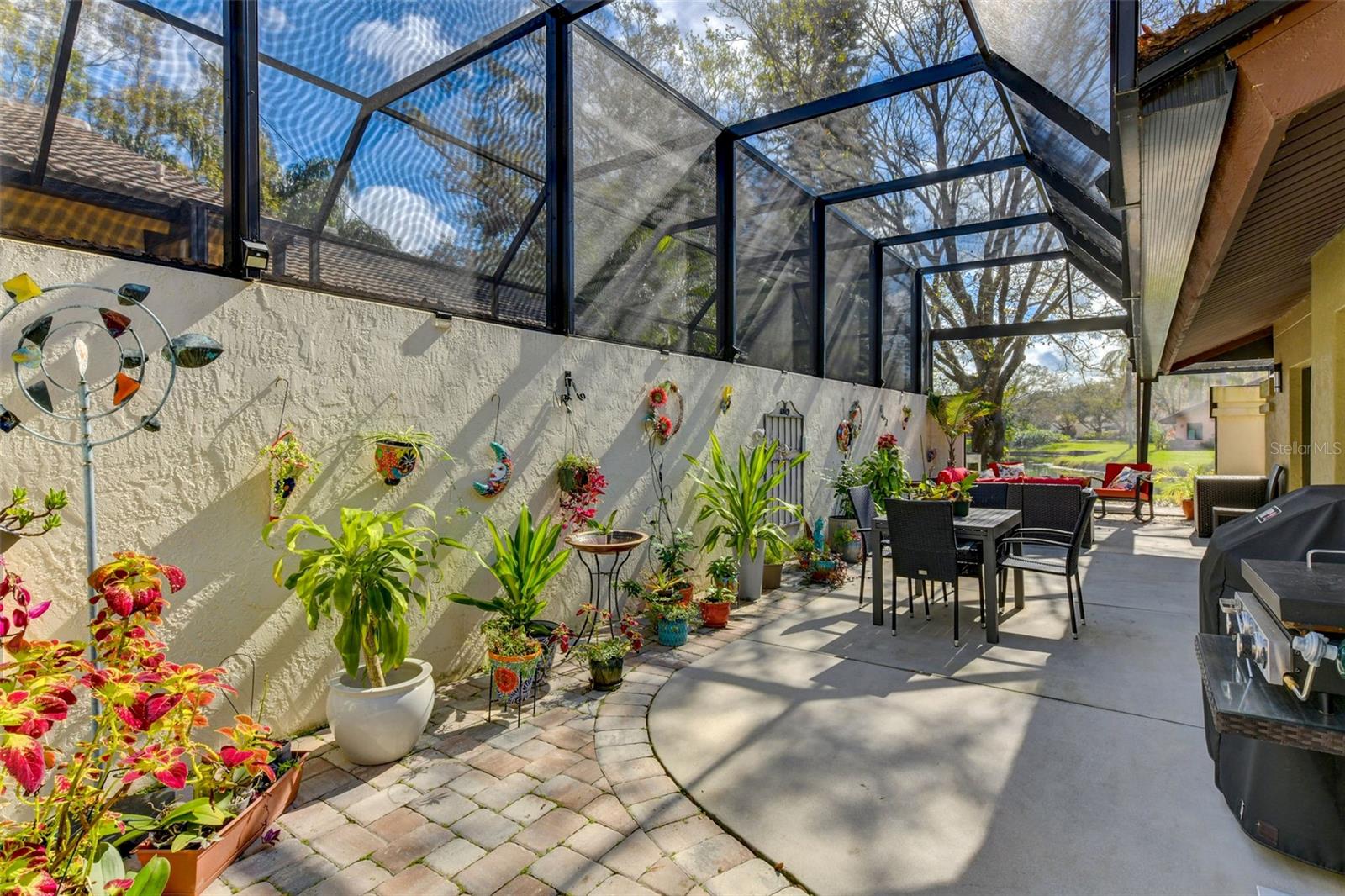 Another entertaining area in the side porch with the well appointed screen