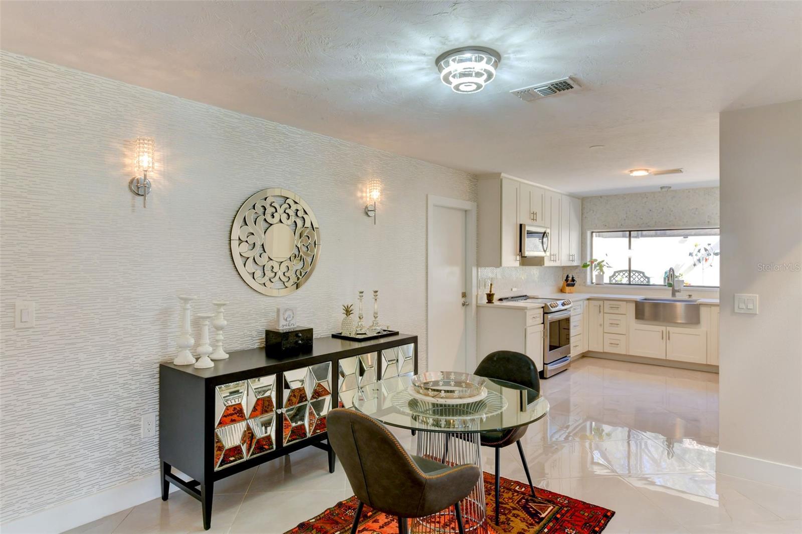 Dinette area off the kitchen with adorable light fixtures