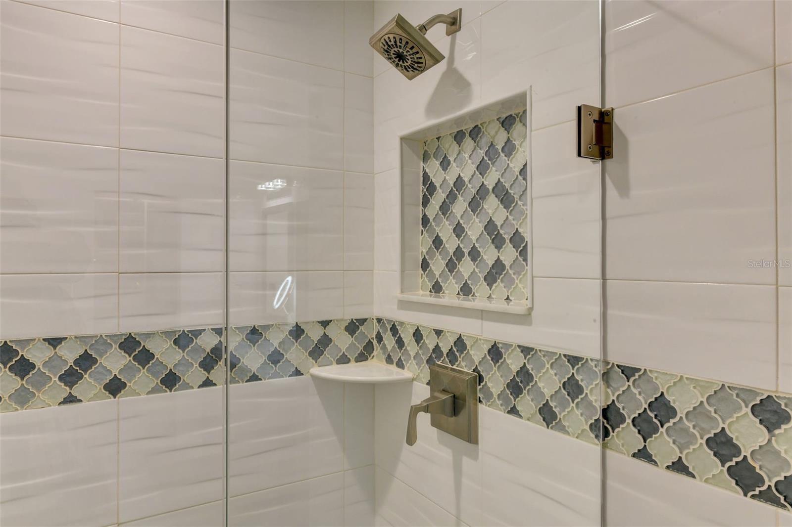 Glass accent walk in the main bathroom