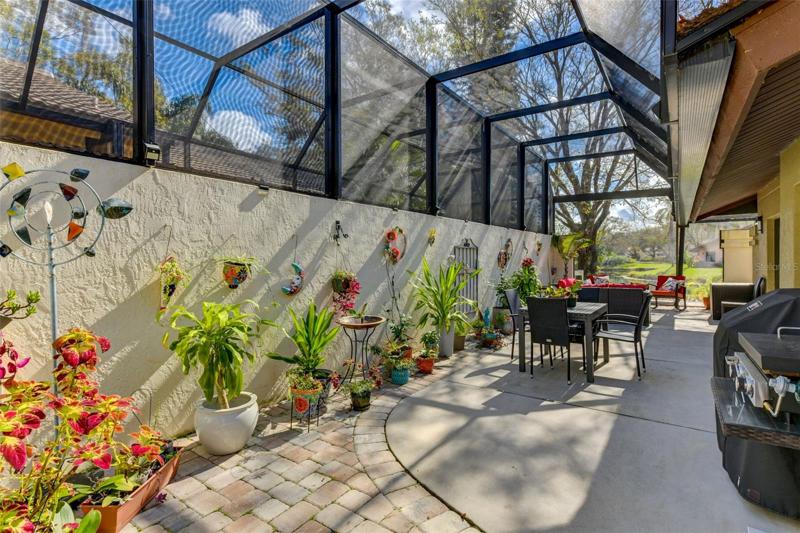 Another entertaining area in the side porch with the well appointed screen