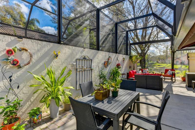 Different seating areas in the screened side porch