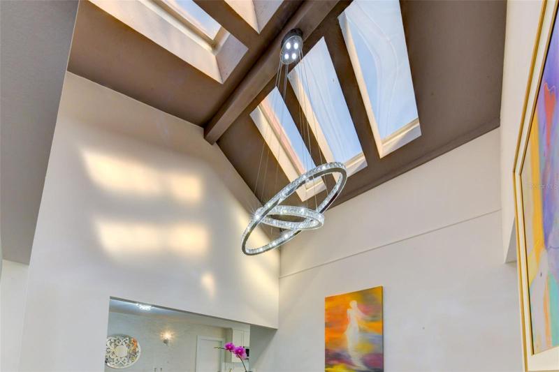 High ceiling in the dining area with skylights