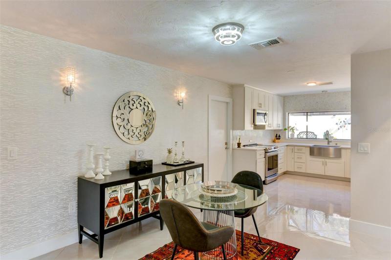 Dinette area off the kitchen with adorable light fixtures