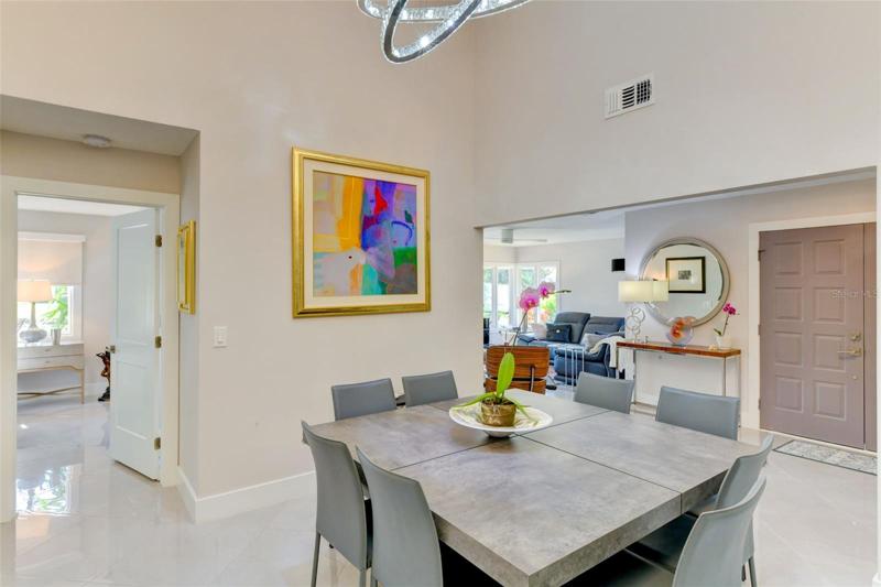 Dining area with high ceiling