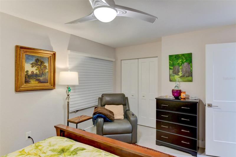 Third bedroom with ceiling fan and closet
