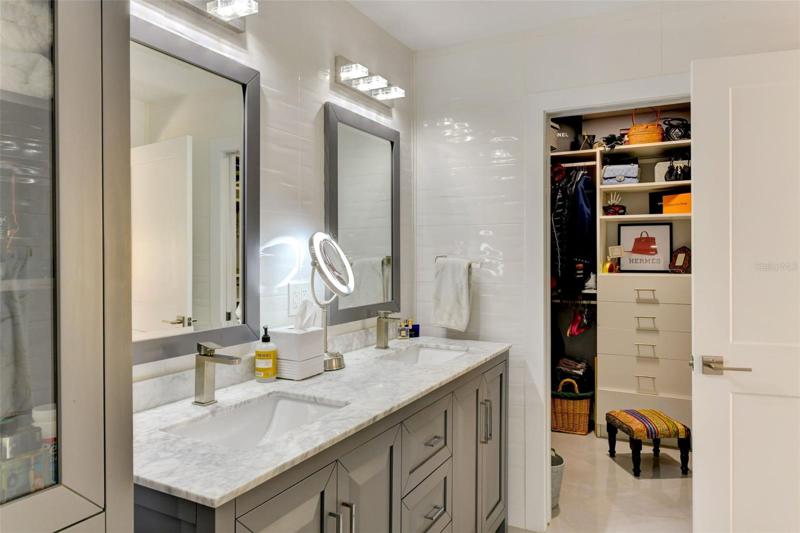 Main bathroom with a view of the walk-in closet