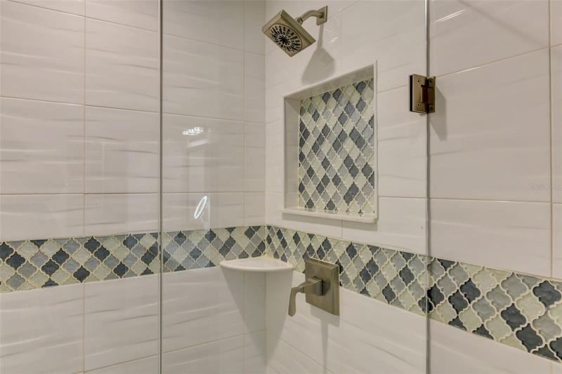 Glass accent walk in the main bathroom