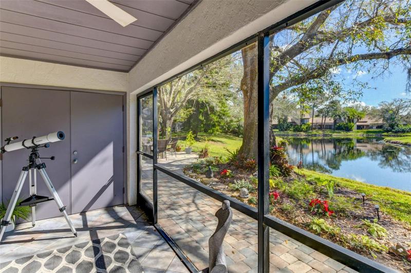 Storage closet in the covered and screened-in back porch with dreamy view of the lake