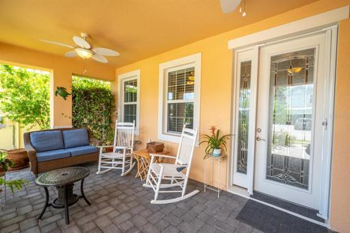 Brick pavers and 2 ceiling fans finish the  front porch.