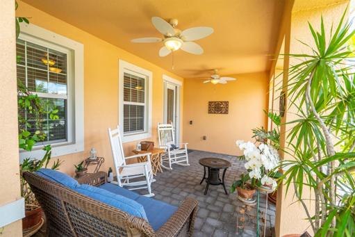 Enjoy your morning coffee on this inviting front porch.