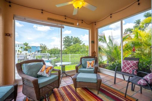 Back covered/screened in lanai. Perfect place to watch the sunset!