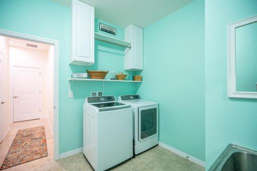 Colorful laundry room on 1st floor.