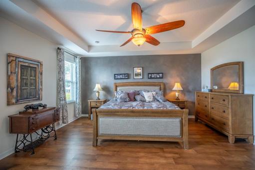 Notice the tray ceiling and lovely accent wall.