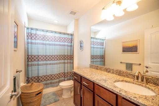 Guest full bath upstairs in between guest bedrooms.