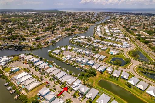 Aerial view of community and canal leading out to the Bay.