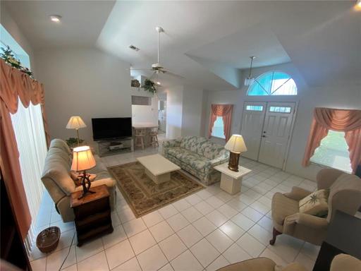 Living room - view 2.  Note the height of the ceiling.  Kitchen entrance in the background.