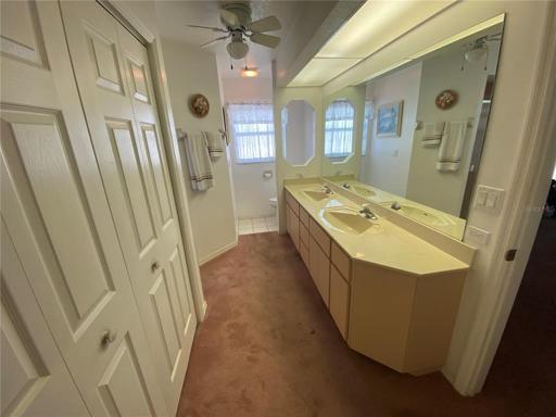 Master bath - view 2.  Toilet is behind the far wall.  Note the amount of storage available in the vanity.