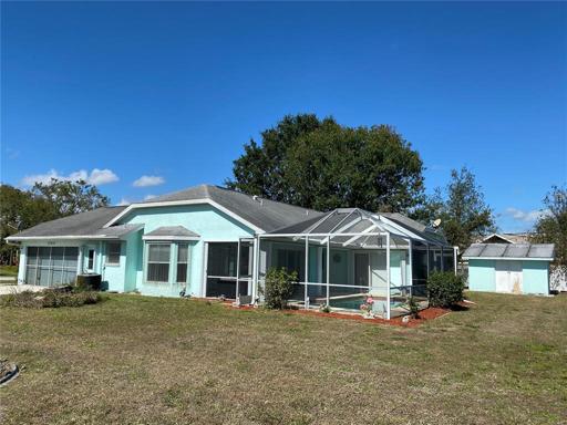Right side view showing storage shed.