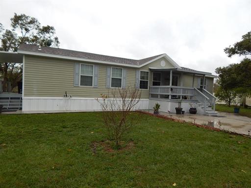 Front of home with front porch and back porch in view
