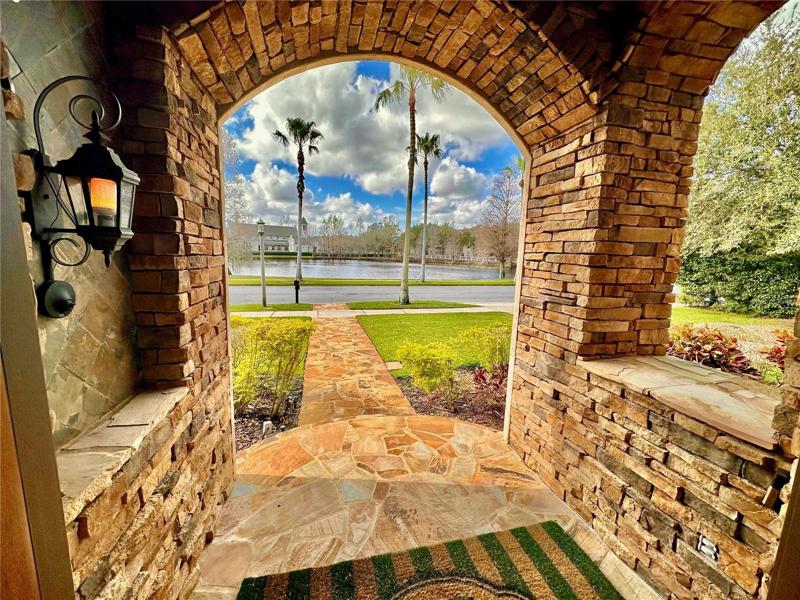 Serene water view with palm trees from front of the home (as well as the back!)