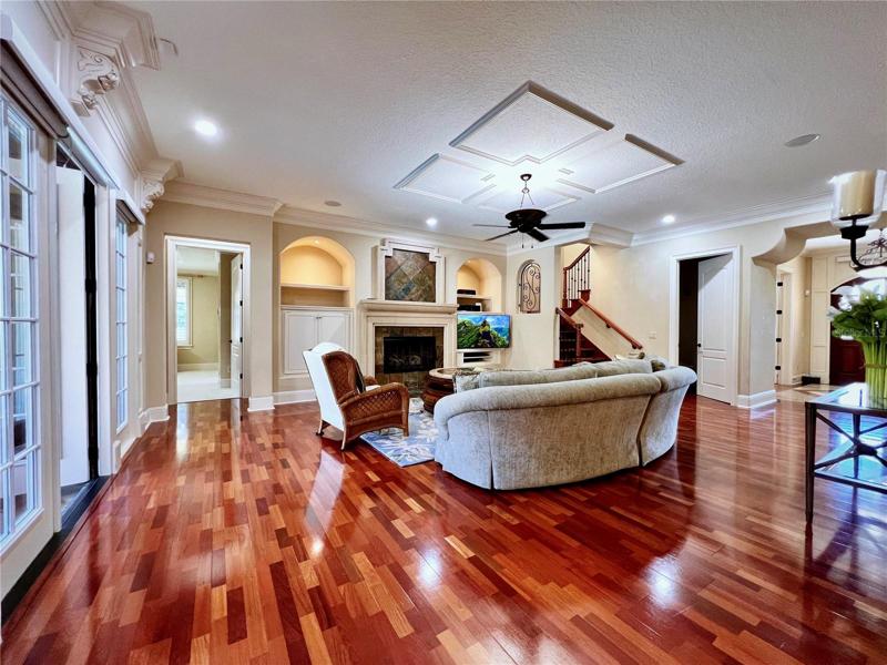 Living Room and Cozy Fireplace at Center of Open Floor Plan