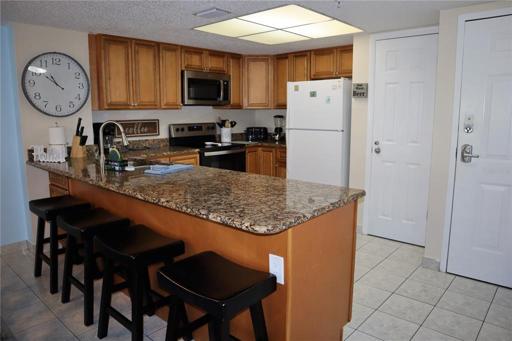 Welcome in! The kitchen is right by the front entrance and features beautiful updates you'll love.