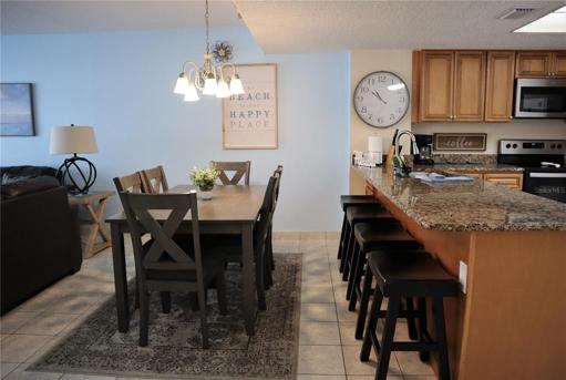 Dining space and bar stool seating off of the kitchen