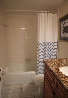 Guest bathroom with a tub/shower combo.