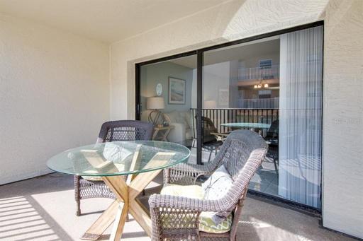 Balcony with a side view of the beach