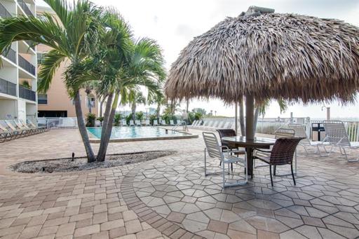Tiki umbrellas and seating around the pool and sundeck
