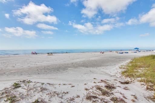 Miles of sugar sandy beaches right behind the building!