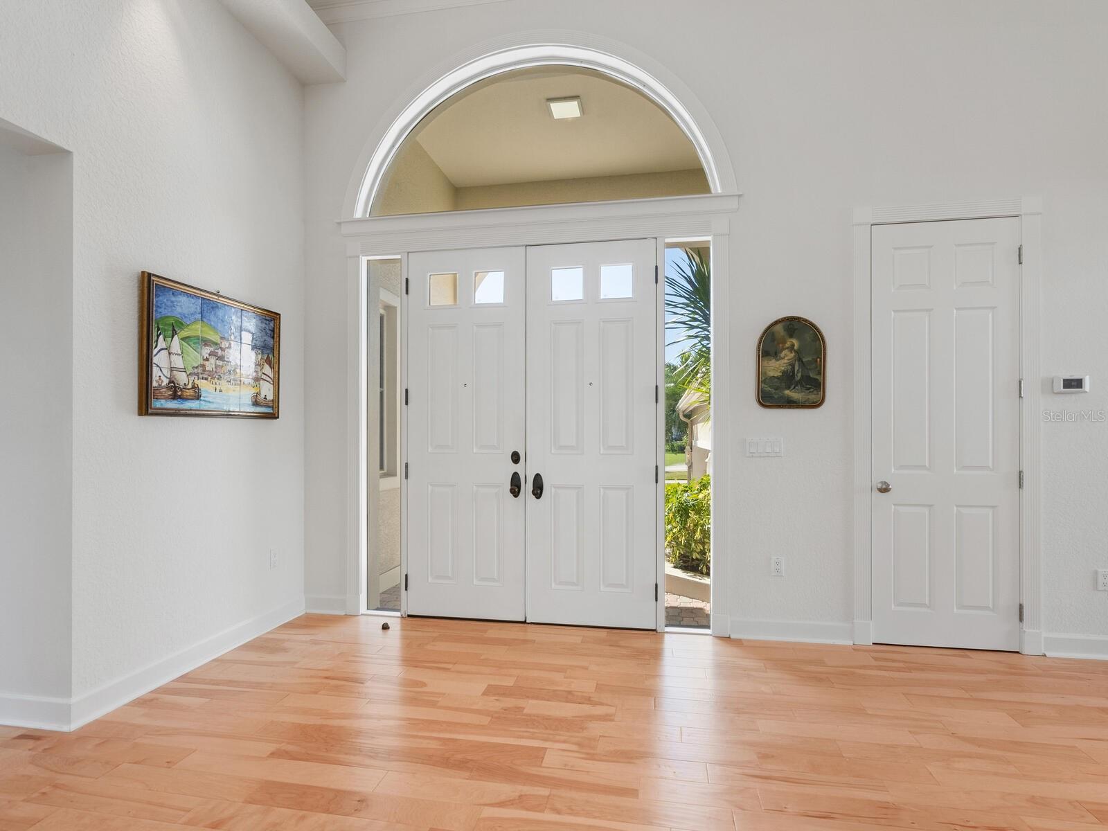 A grand foyer with soaring ceilings