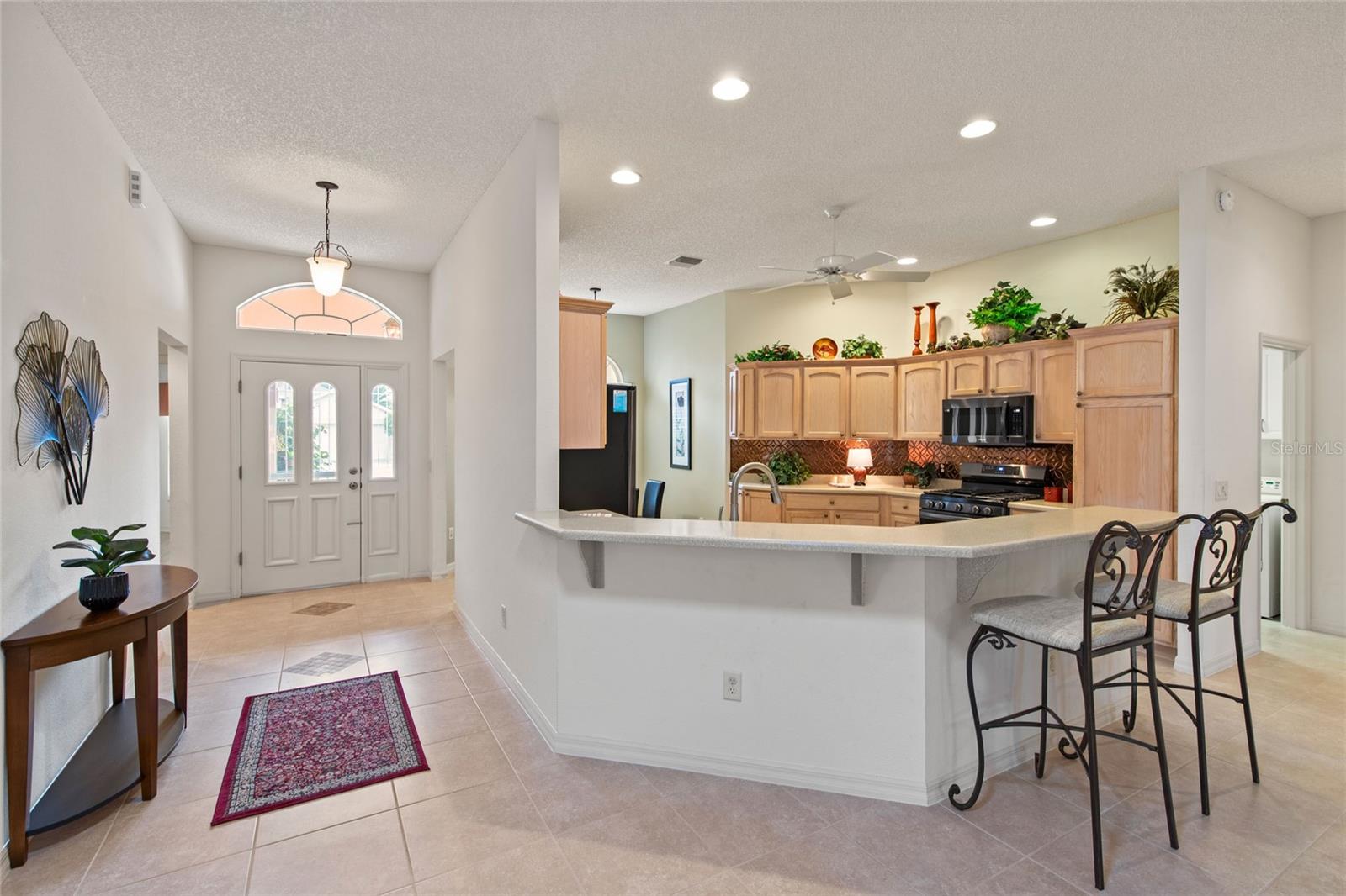 From Family Room to Foyer and Kitchen
