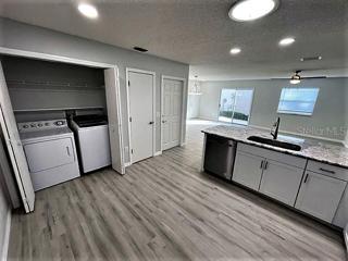 Kitchen facing Laundry and Living room
