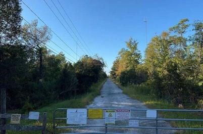 Entrance to Dill Rd is Gated. Lot is NOT accessible to this road.