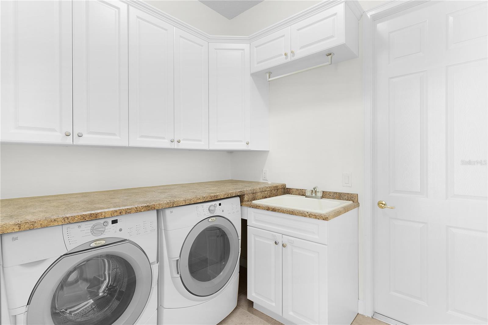 Laundry Room With Laundry Sink and Cabinetry