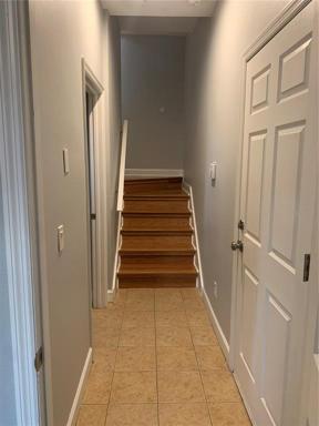 First Floor Hallway and Steps to Living Area