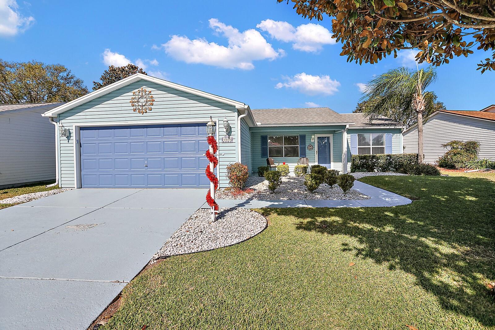 Front View of Home with Two Car Garage and Electric Screen