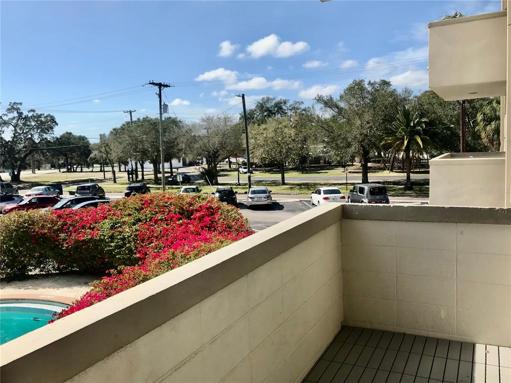 Balcony view looking southwest. Resident parking on west side of building.