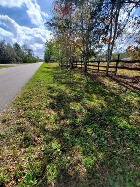 Edge of property and road traveling South