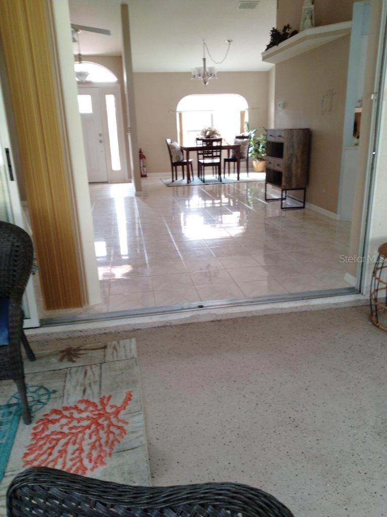 Standing in the Florida room, looking into living areas