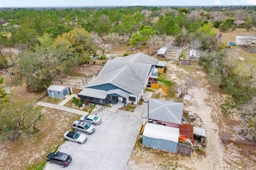 aerial view of buildings a& parking area