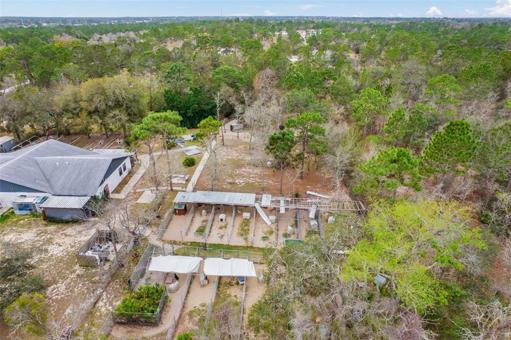 aerial view of outdoor kennels in the back