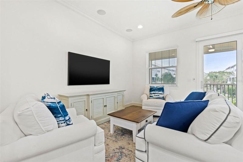 Cozy and clean living space with a balcony just off the home.