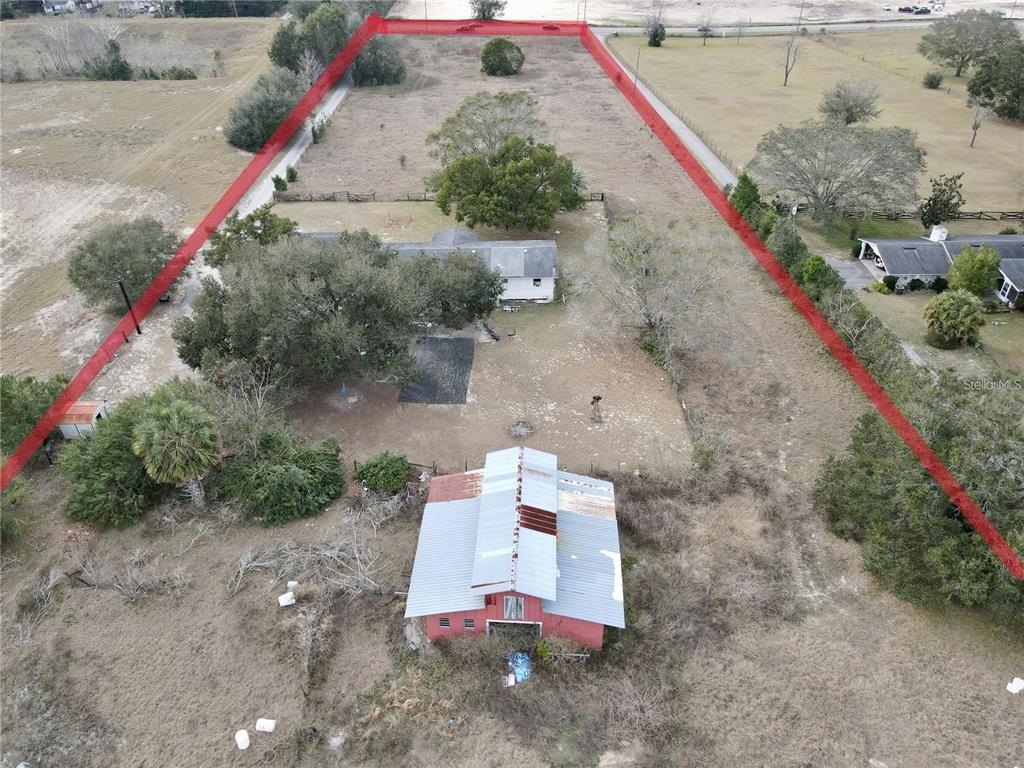 Overhead view of property and proximity to Plymouth Sorrento Rd and approximately 15ft setback. Lot is approximately 965ft deep and 223 ft wide.