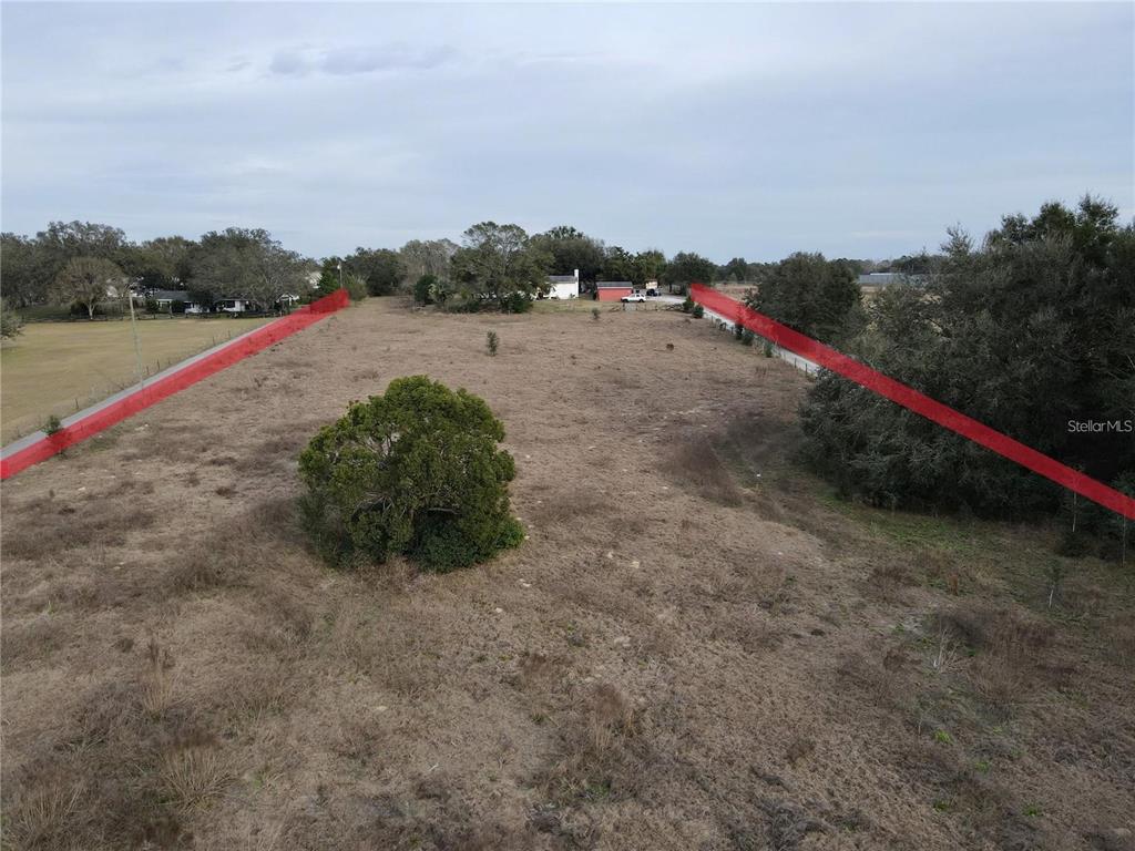View of lot width, the land does have a small elevation change front to back from the road.