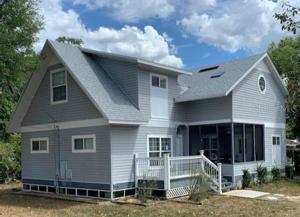 Brand new roof in April 2023.   This charming home has a enclosed front porch to relax in and enjoy a glass of wine or morning coffee.
