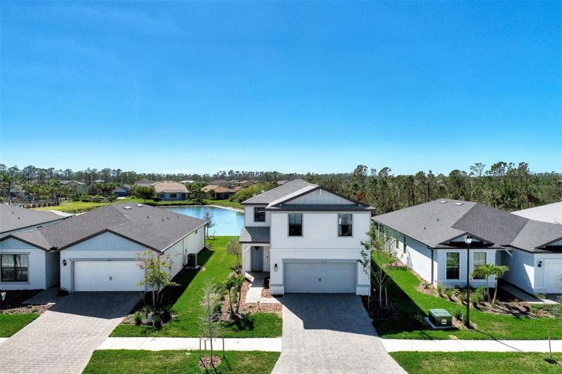 2509 Buckthorn Loop built in 2022 has pavered driveway and beautiful view of Lake