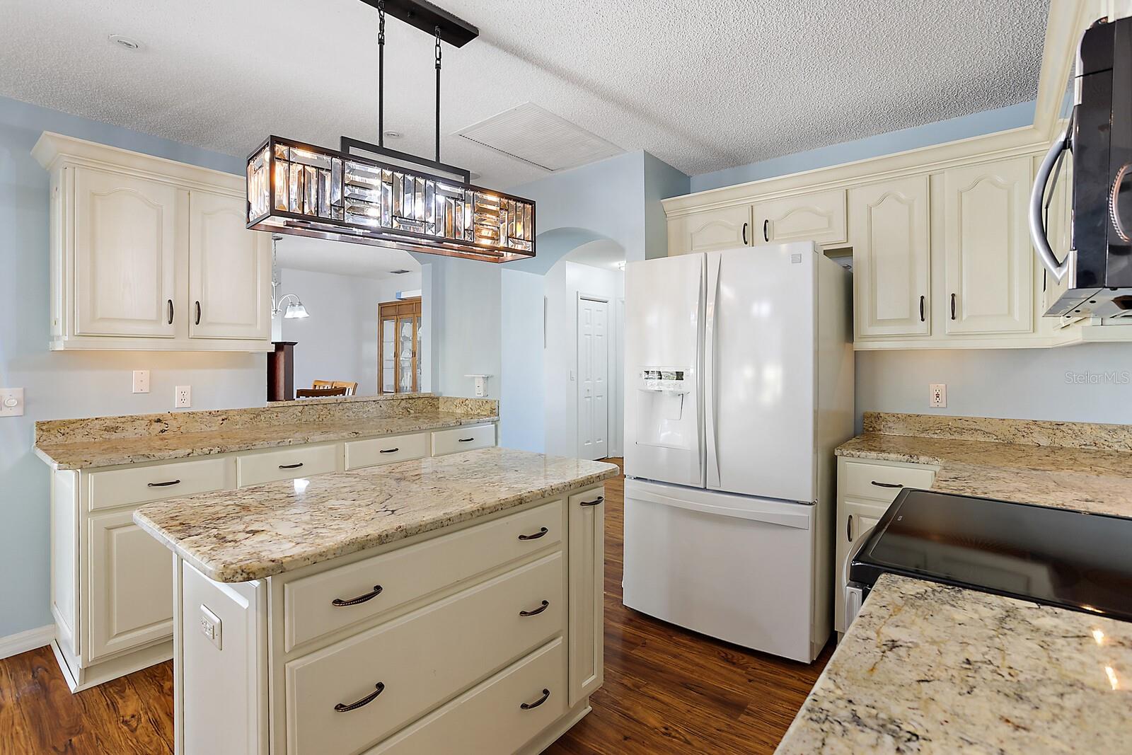 Kitchen w/butler's window to dining area
